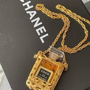 CHANEL Gold Tone Coco Eau de Parfum Bottle Pendant Necklace with coco bottle 18”